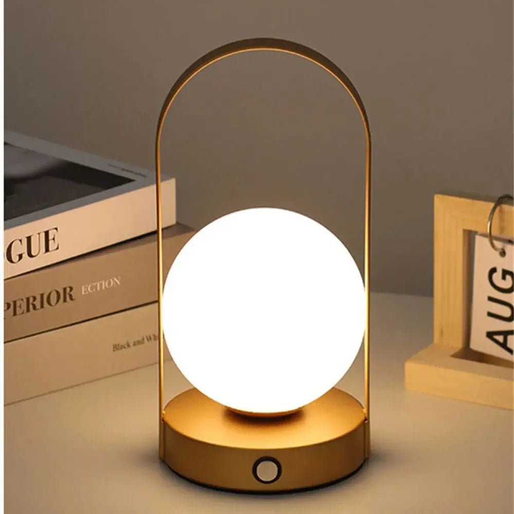 Portable rechargeable LED table lamp, dimmable for home & outdoor use.