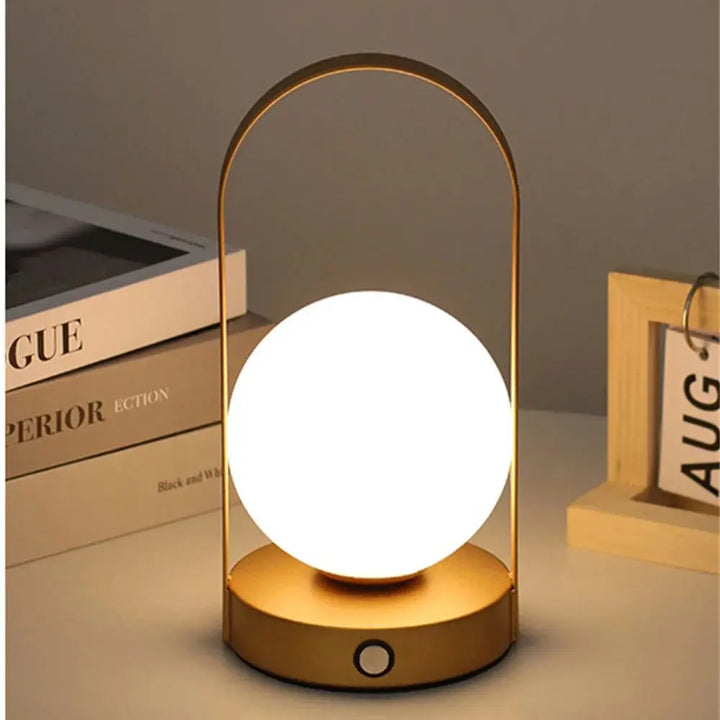 Portable rechargeable LED table lamp, dimmable for home & outdoor use.