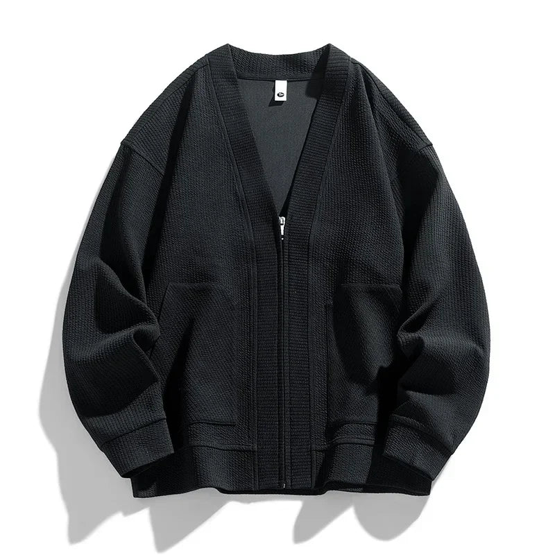 Black men's relaxed fit zip-up sweater, comfortable and versatile for casual wear or layering as a jacket.