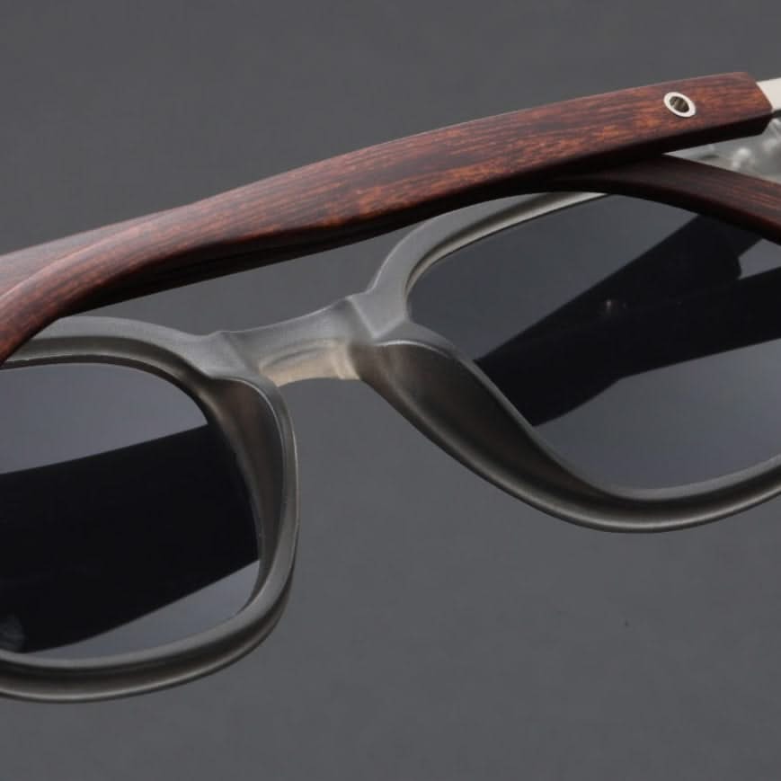 Fashionable acetate sunglasses for men & women, featuring sturdy wooden arms & UV shield.