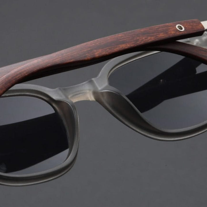 Fashionable acetate sunglasses for men & women, featuring sturdy wooden arms & UV shield.