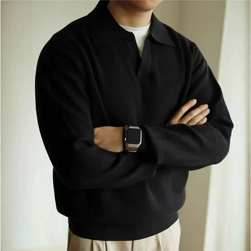 Stylish black men's knit polo, classic fit. Soft, breathable fabric for versatile, comfortable everyday wear.