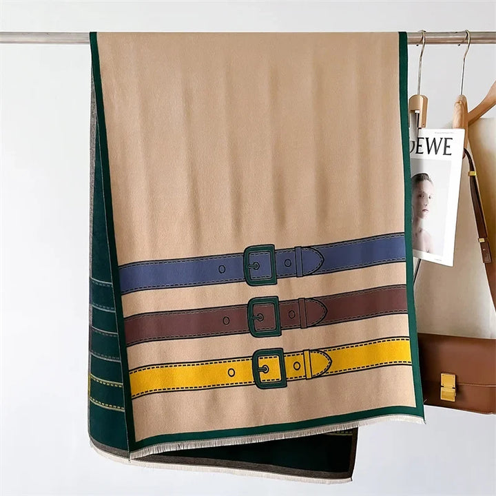Classic cream cashmere blend scarf, a warm and elegant unisex accessory with a refined belt buckle design.