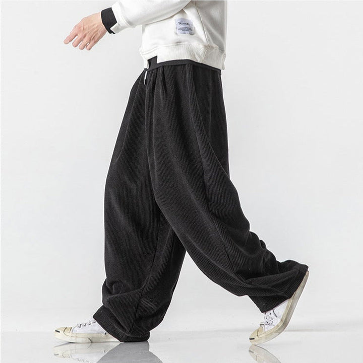 Comfortable unisex relaxed fit sweatpants for casual wear, featuring a drawstring and pockets.