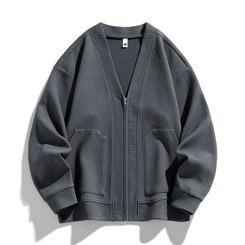 Gray men's full zip sweater with practical pockets, relaxed fit for ultimate comfort. Stylish casual outerwear.