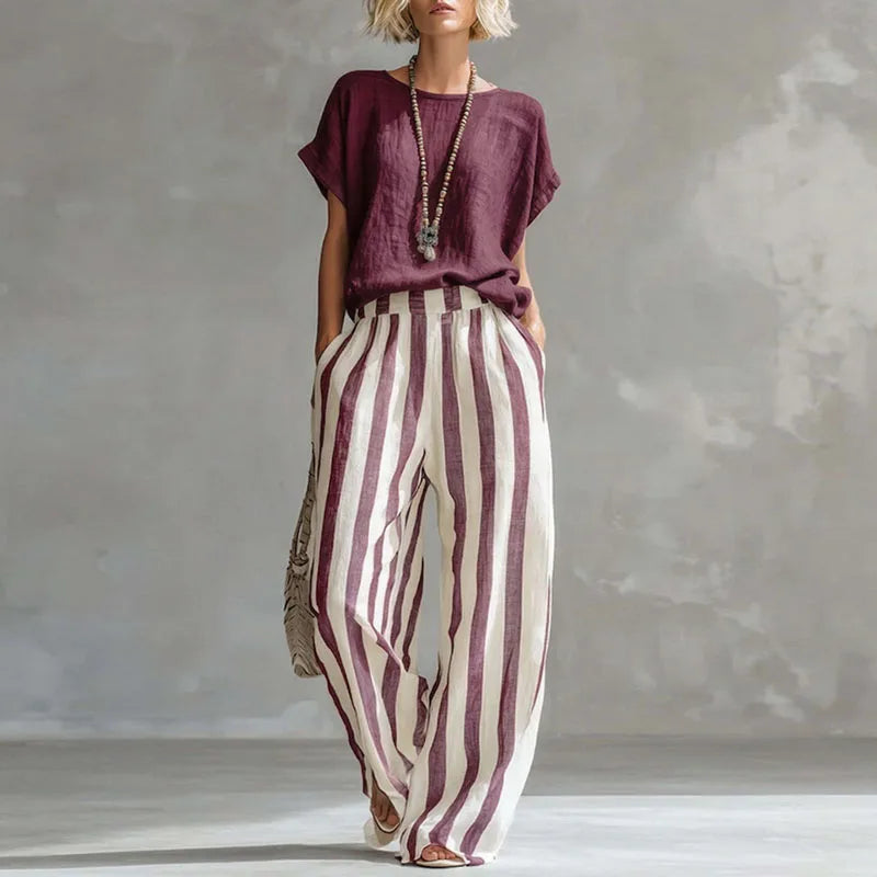 Women's stylish linen two-piece summer set. Relaxed top and wide-leg pants, ideal for casual and breathable comfort.
