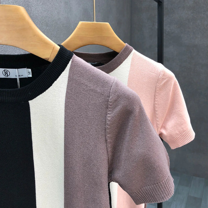 Stylish men's black & pink color block crewneck sweater. A comfortable long sleeve top for modern fall & winter fashion.