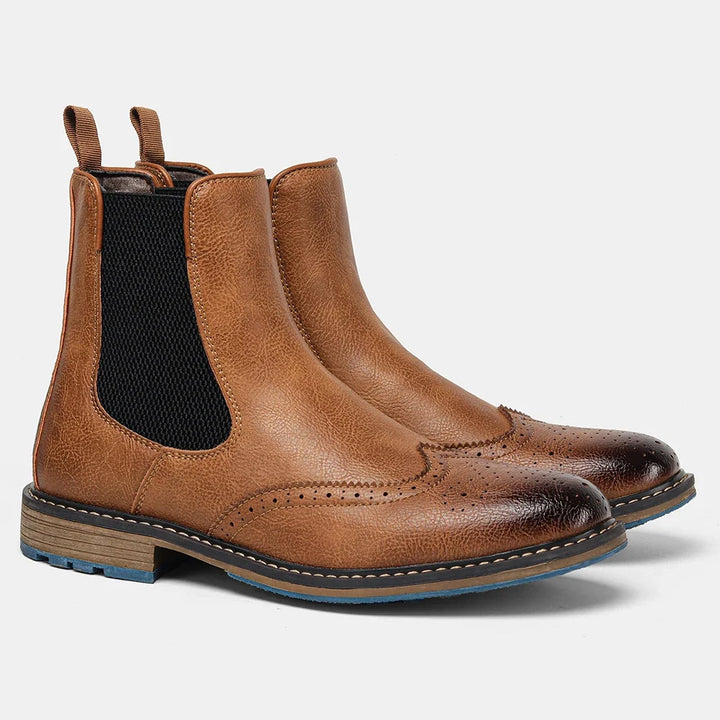 Comfortable men's footwear, elegant Chelsea boots perfect for office or evening, showcasing a bold blue sole.