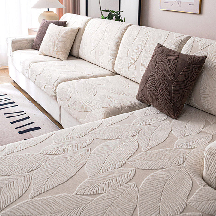 Durable jacquard leaf design waterproof sofa cover. Stretch slipcover offers pet & stain resistant furniture protection.