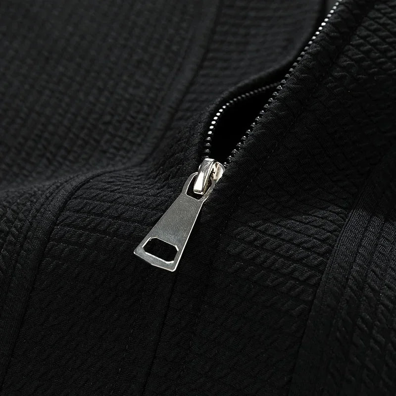 Men's casual zip-up sweater with pockets, relaxed fit for comfort and easy layering. Essential men's outerwear.
