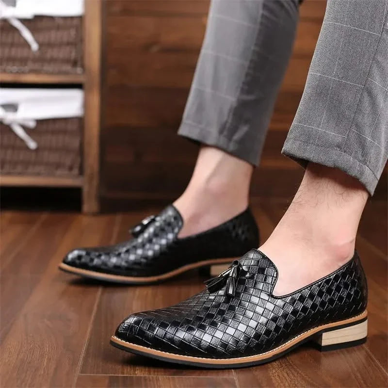 Close-up of men's woven loafers with decorative tassels. Comfortable & durable dress shoes for men's fashion.