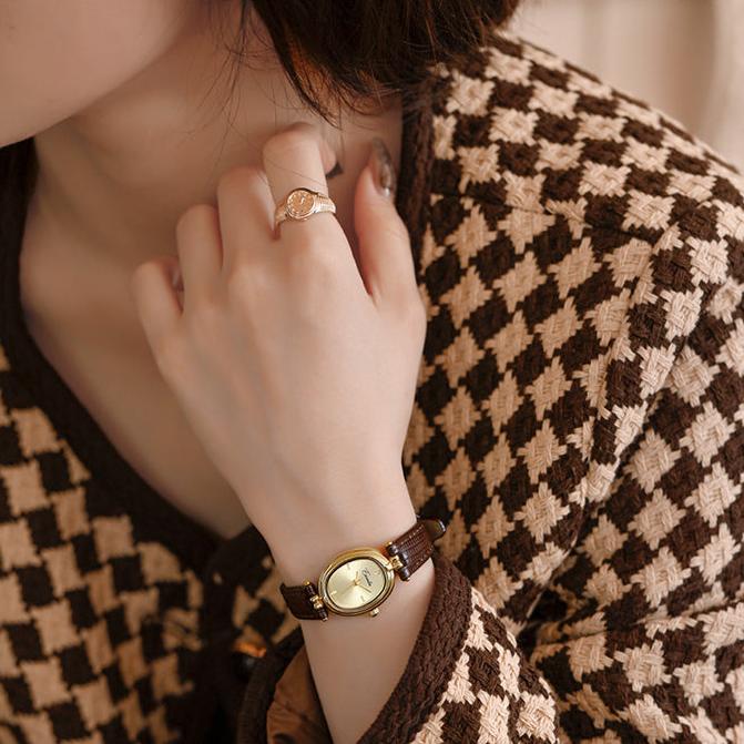 Sophisticated women's elegant slim wristwatch, a perfect accessory for any occasion. Available in black or brown.