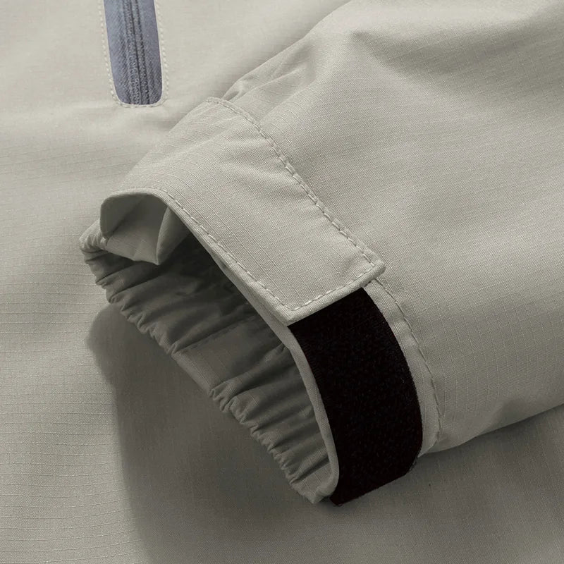 Beige white men's technical hooded jacket, windproof & waterproof outerwear suitable for all-weather activities.