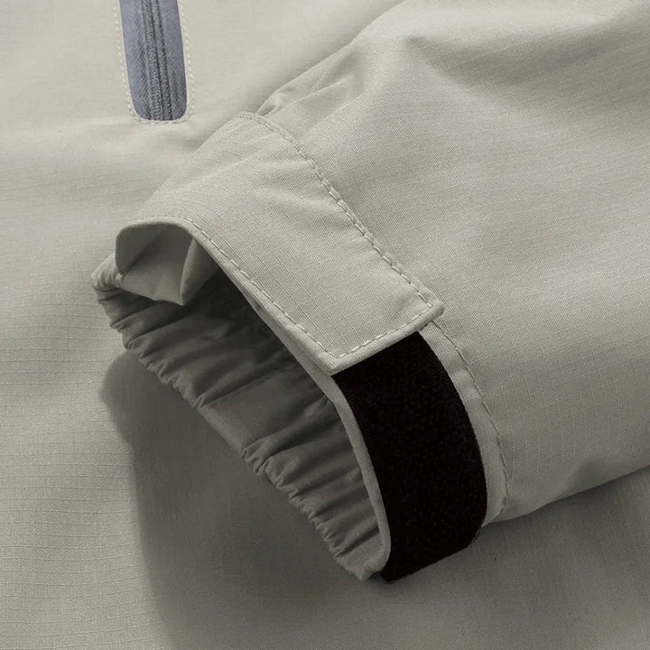 Beige white men's technical hooded jacket, windproof & waterproof outerwear suitable for all-weather activities.