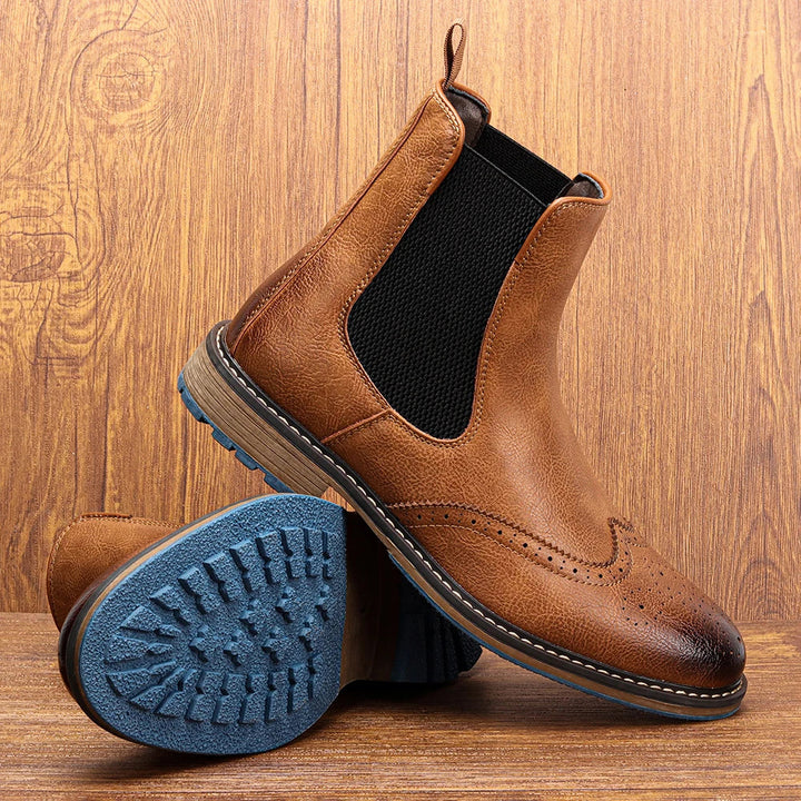 Men's comfortable Chelsea boots, sleek design, elastic side panels, and a distinctive blue sole for versatile style.