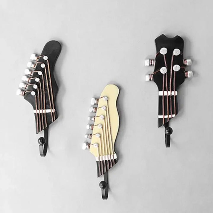 Chic musical guitar wall hooks set. Functional decorative hooks for keys, coats, or scarves, enhancing any entryway.