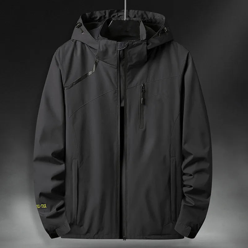 Dark gray men's hooded casual jacket, windproof & waterproof technical outerwear for all-weather protection.