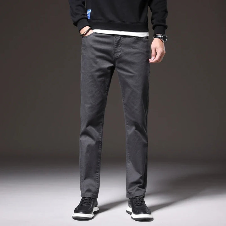 Back view of men's well-fitting khaki cotton chino trousers. Provides comfort, style & a clean silhouette.
