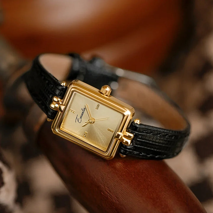 Black women's elegant slim wristwatch, featuring an oval dial. A sophisticated classic timepiece accessory.