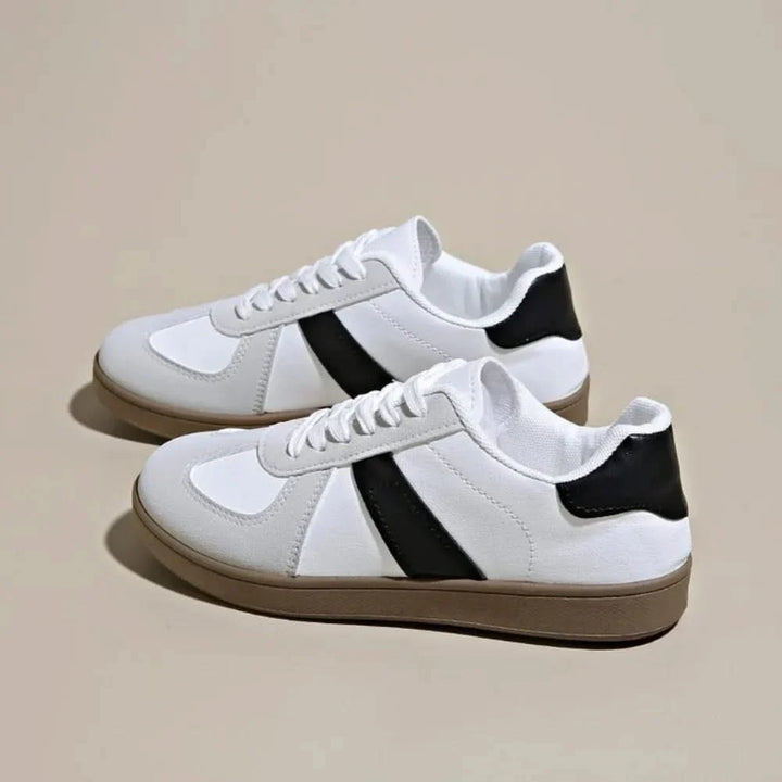 Fashionable gold & black women's shoes, combining modern design with ultimate walking comfort.