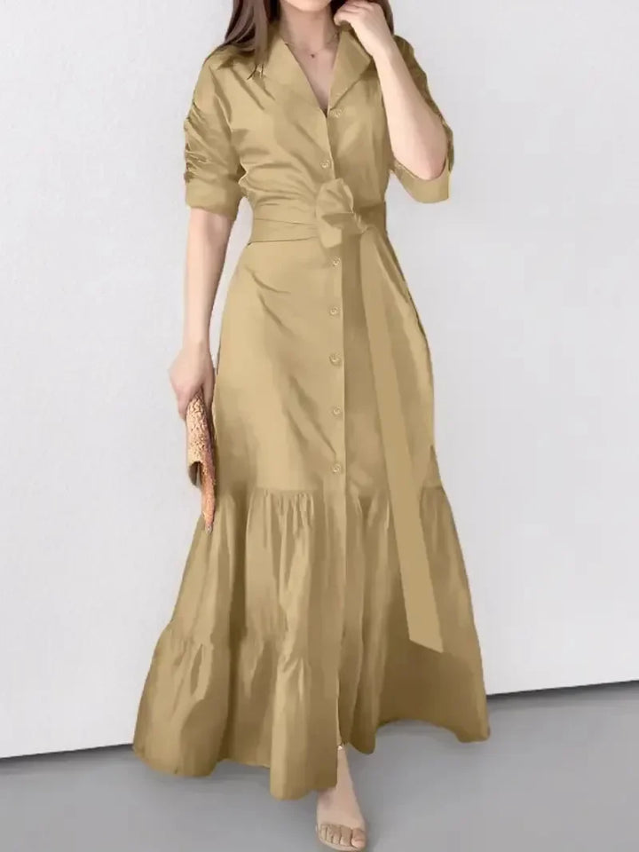 Stylish women's long sleeve maxi dress in soft fabric, featuring elegant tiers and a fashionable tie waist.