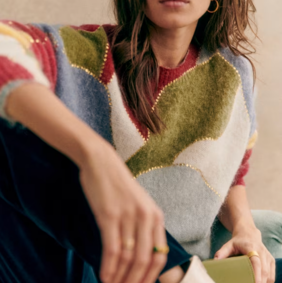 Chic women's soft textured patchwork sweater. A comfortable long-sleeve crewneck top, ideal for fall and winter fashion.