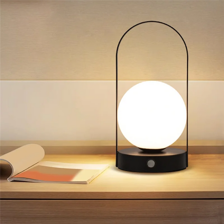 Contemporary LED table light, rechargeable, dimmable for bedroom, office, or outdoor.