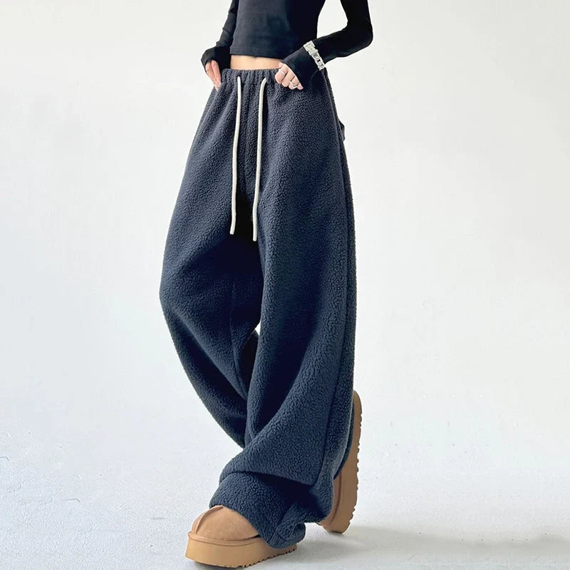 Cozy unisex lounge pants, ultra-soft fabric, featuring a comfortable relaxed fit & adjustable drawstring waist.
