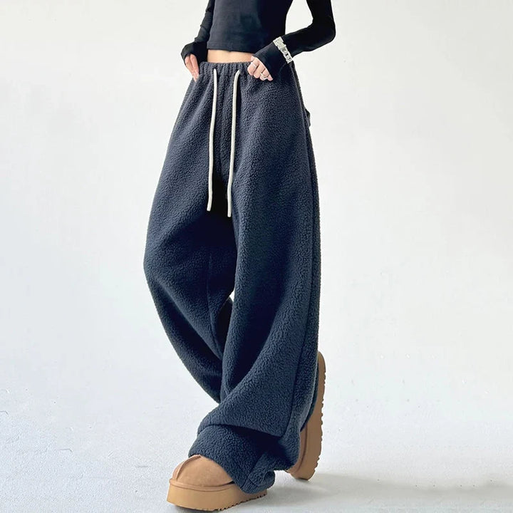 Cozy unisex lounge pants, ultra-soft fabric, featuring a comfortable relaxed fit & adjustable drawstring waist.