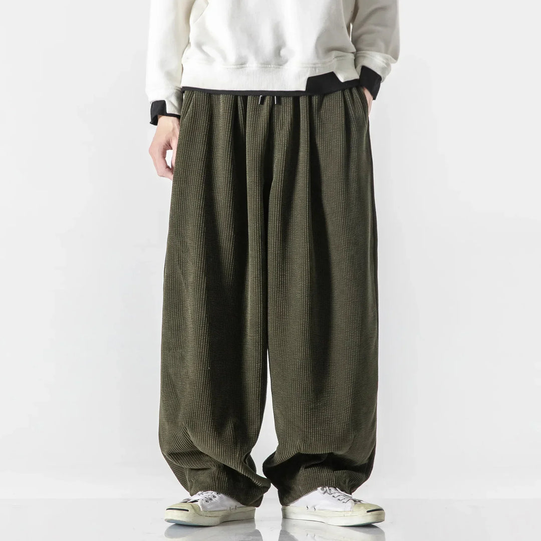 Practical unisex sweatpants with a relaxed fit, complete with convenient side pockets for essentials.