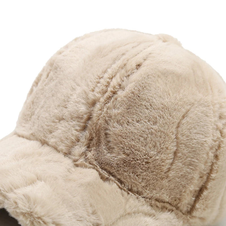 Fashionable women's plush faux fur hat, a warm and cozy winter accessory for stylish headwear.