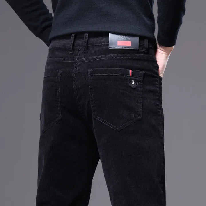Textured premium corduroy dress trousers, showcasing luxurious drape & tailored fit for men.