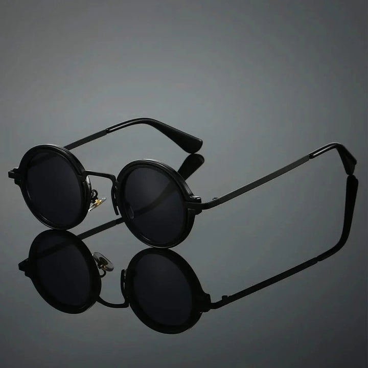 Gold frame vintage round sunglasses, unisex, with anti-glare lenses. Lightweight retro eyewear for sun protection.