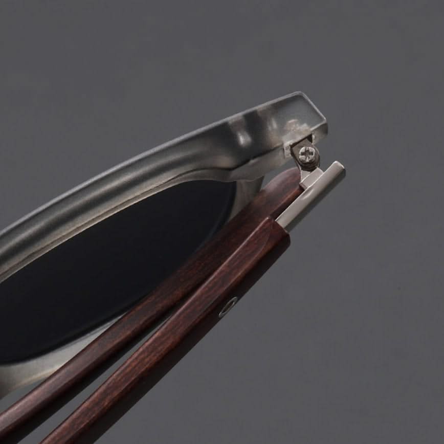 Premium unisex eyewear: black acetate frames combined with smooth wooden arms.