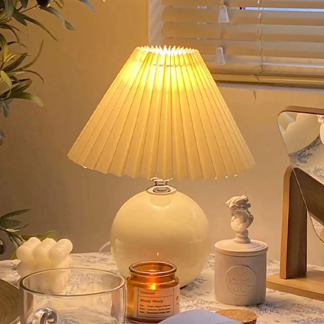 Modern foldable LED pleated table lamp, ideal for space-saving and versatile accent lighting.