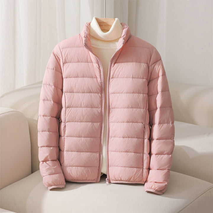 Beige women's lightweight quilted puffer jacket. Stylish, warm, & cozy winter outerwear.