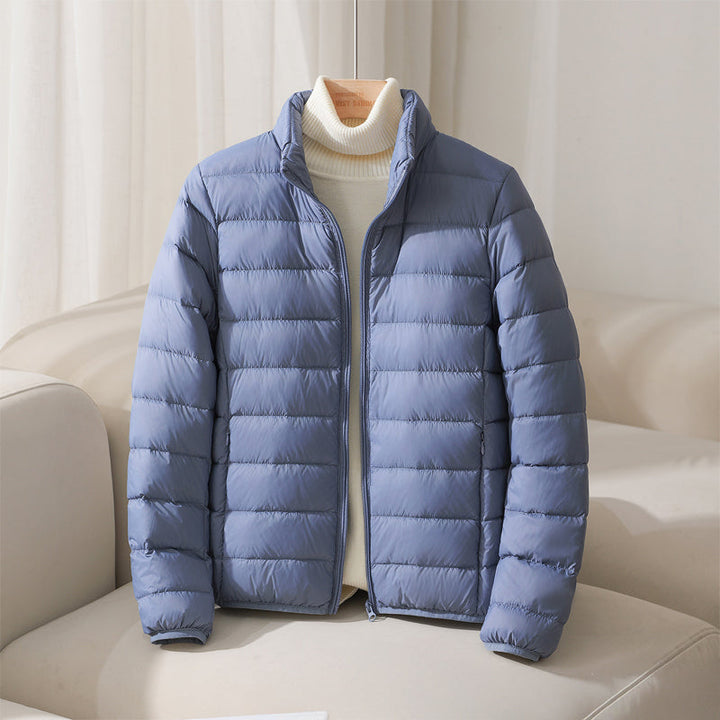 Pink women's lightweight puffer jacket. Quilted design, casual, and perfect for cold weather.