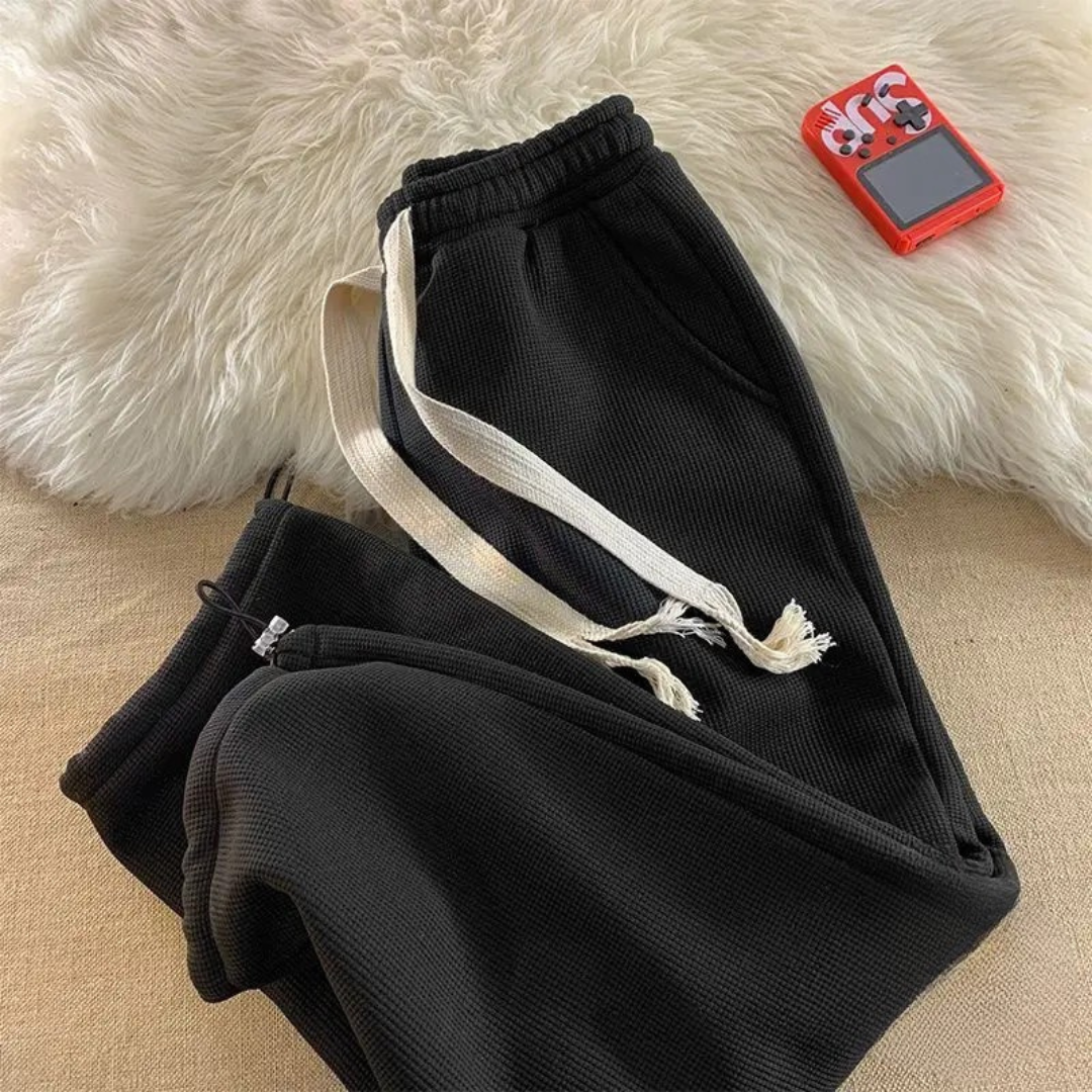 Women's ultra-soft plush lounge pants, offering cozy comfort and relaxed fit for winter sleepwear and casual wear.