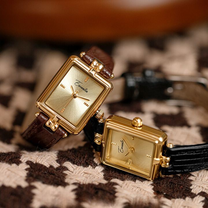 Women's elegant slim wristwatch displayed on a wrist, a classic and modern sophisticated accessory.