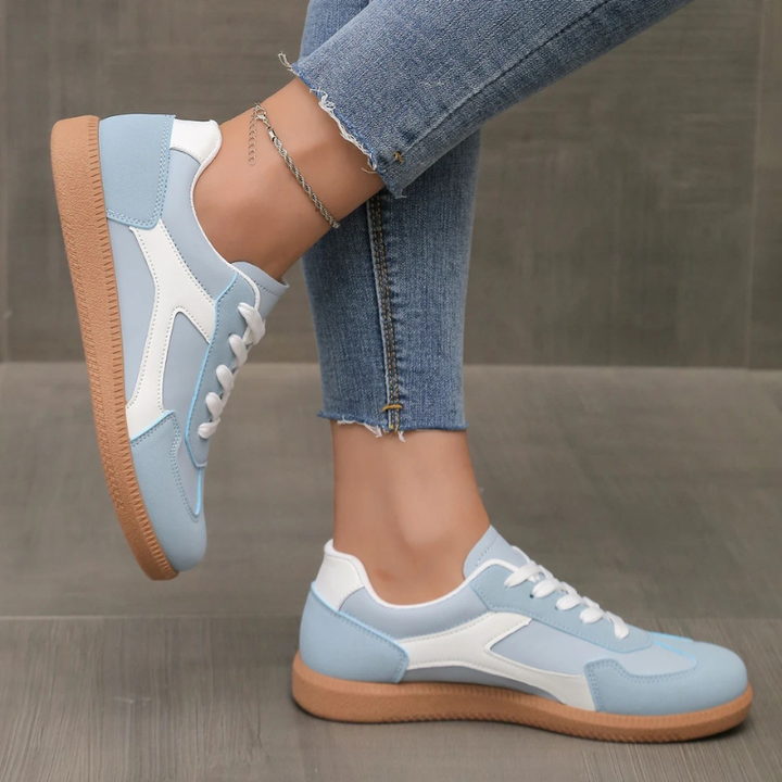 Comfortable blue women's low-profile sneakers for versatile everyday style. Classic casual footwear with support.