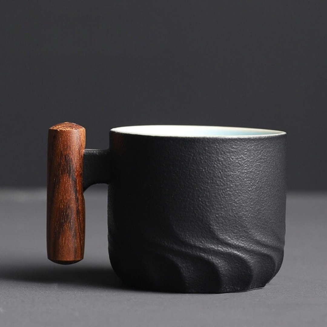 Unique retro espresso mug, handmade ceramic with a rustic wooden handle, perfect for small drinks.