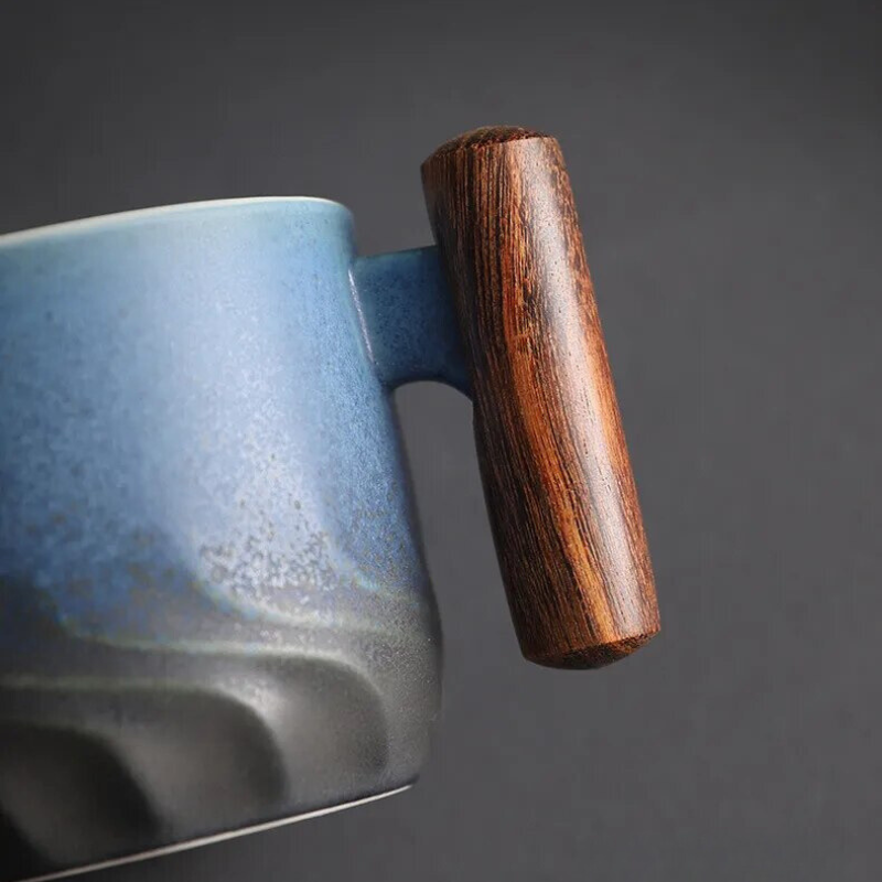 Side view of a retro ceramic espresso mug, highlighting its distinctive wooden handle.