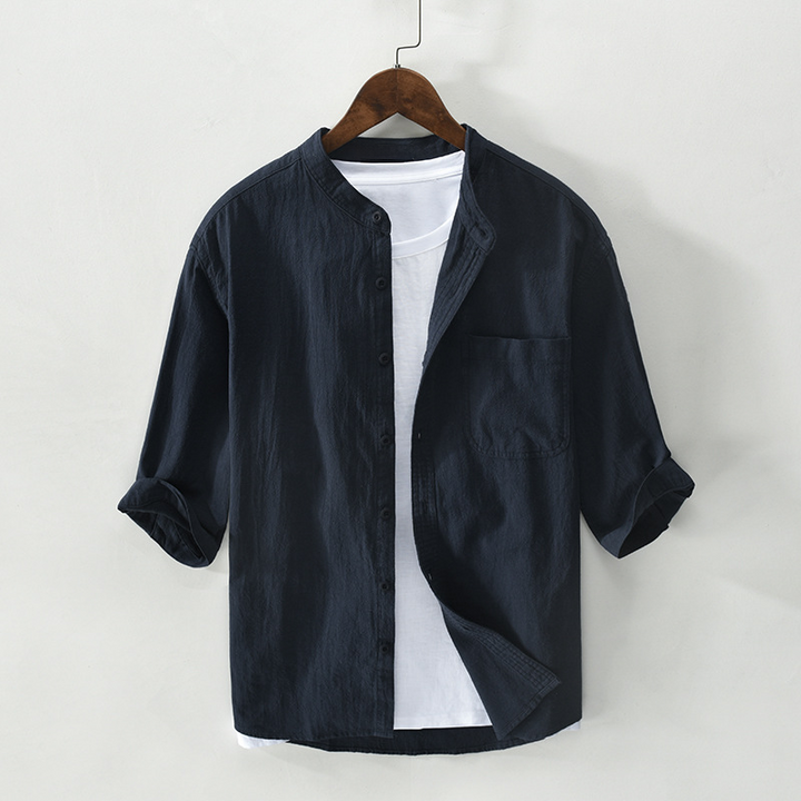 Lightweight men's breathable button-up shirt, relaxed fit, perfect for summer fashion & resort style.