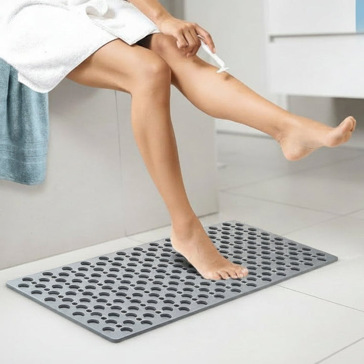 Hygienic anti-slip shower mat ensures comfort & safety. Durable PVC bath mat, easy to clean, luxurious feel.