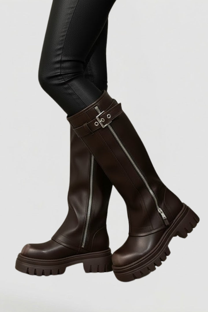 Classic & stylish brown knee-high platform boots for women. Features a convenient side zip and sturdy platform.