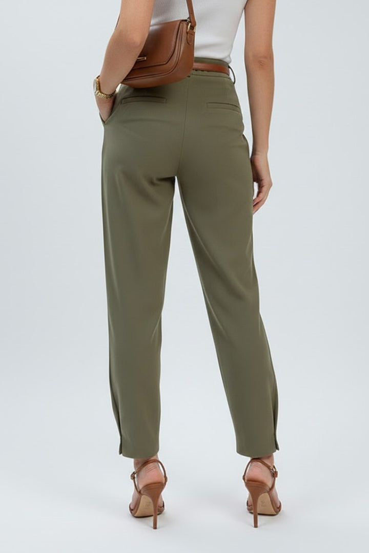 Chic women's high-waisted tapered pleated trousers, offering effortless style for both office and casual wear.