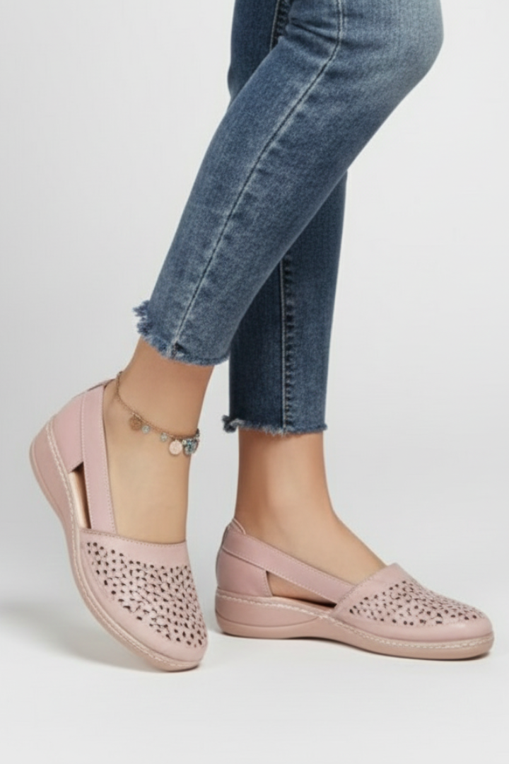 Women's comfortable walking shoes featuring a sturdy sole & elegant cut-outs for all-day support.