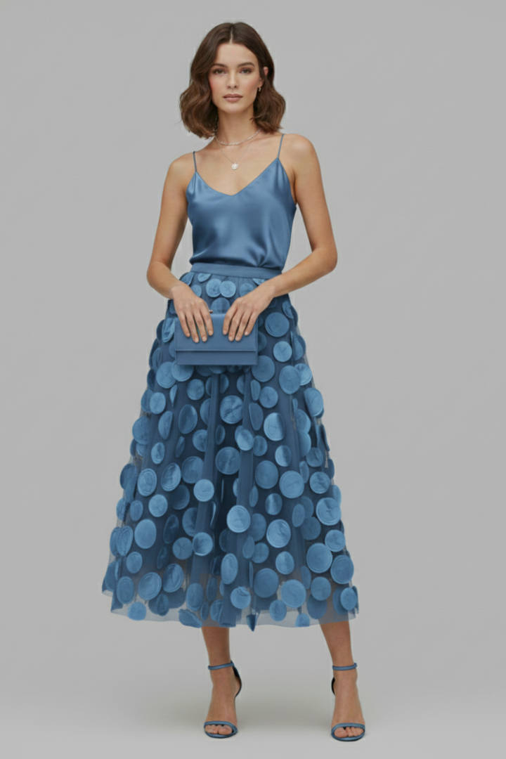 Chic women's polka dot full midi skirt. Elegant A-line with elastic waist for versatile fashion & party wear.