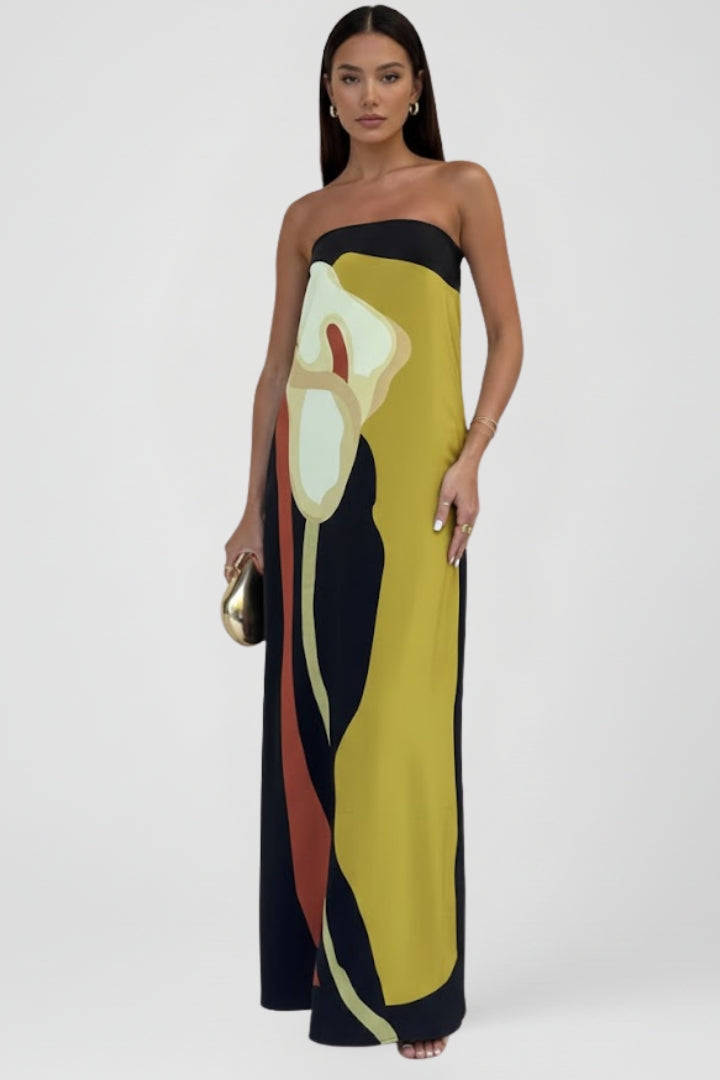 Elegant flowy strapless maxi dress with a colorful abstract print, ideal for casual summer wear.
