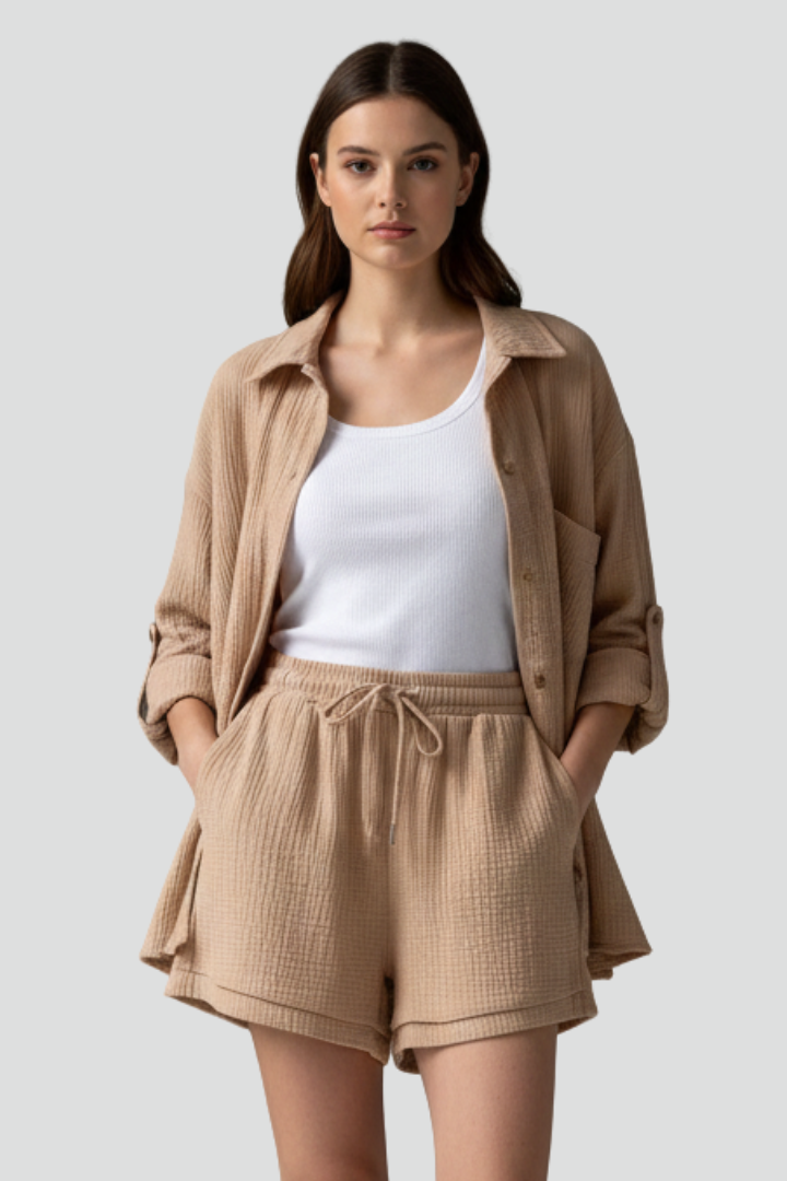 Soft pink women's relaxed lounge set. Comfortable two-piece outfit with long sleeve shirt & shorts.